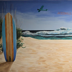 photo of sandy beach and turtles mural