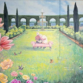 photo of elderly couple sitting on satee in garden